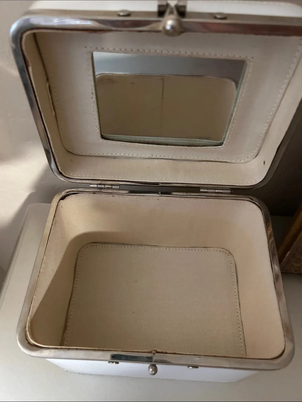 Vintage women’s train case. Would make a cute purse.